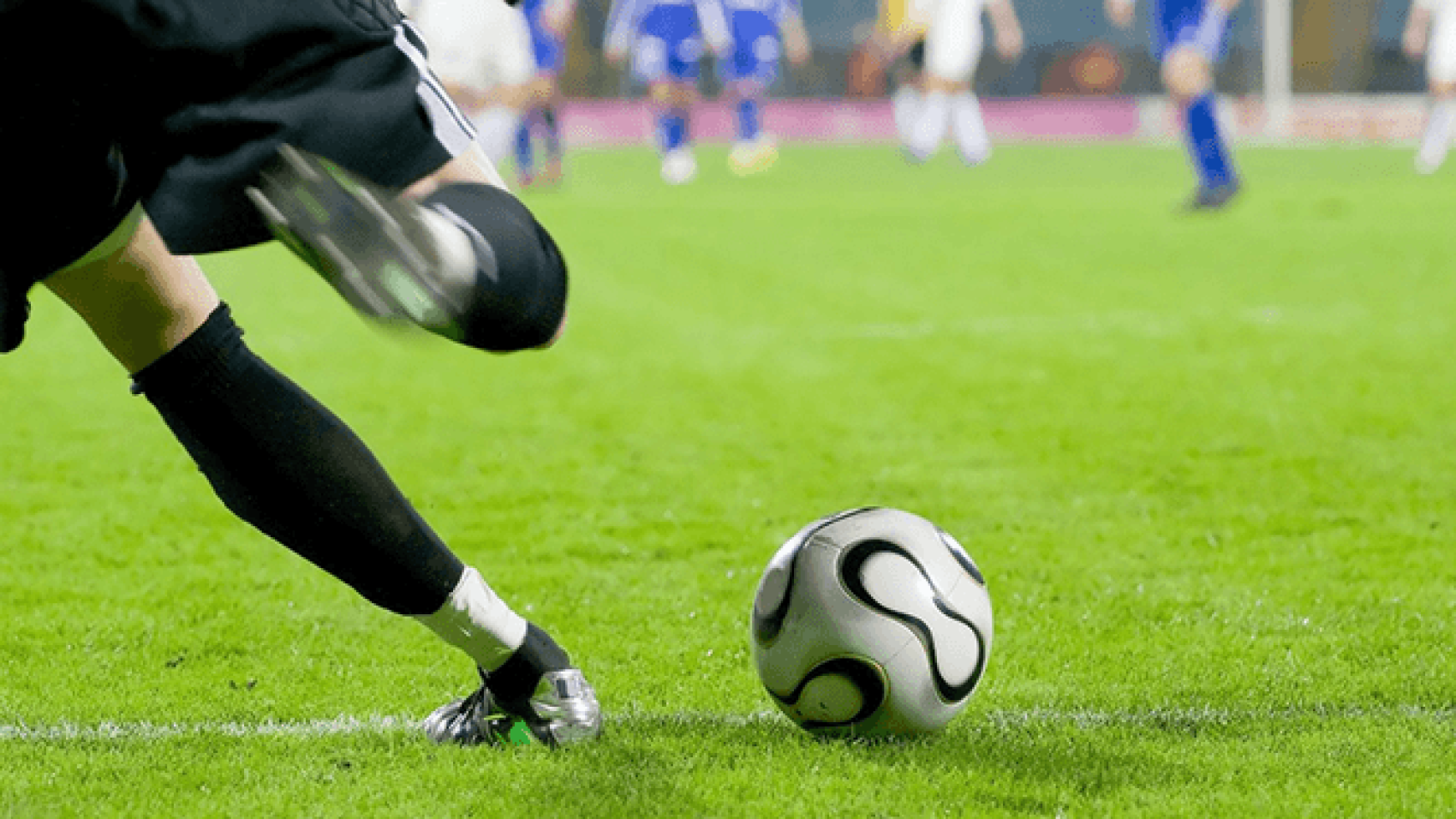 An image of a football field with players on it