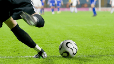 An image of a football field with players on it