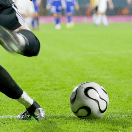 An image of a football field with players on it