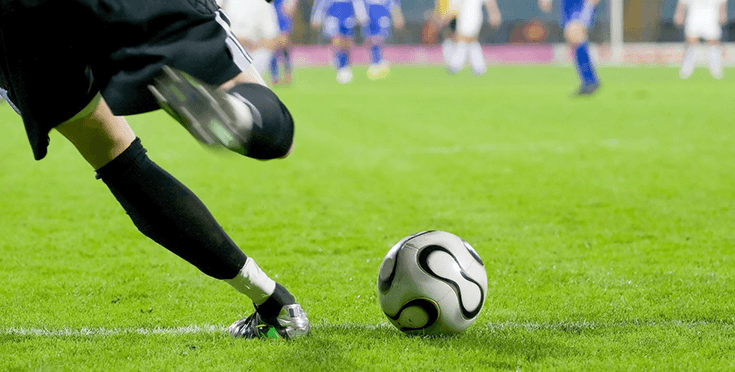 An image of a football field with players on it