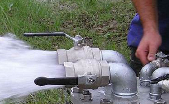 An image of water discharging from a pipe