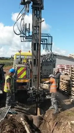 An image of a team of people drilling a borehole