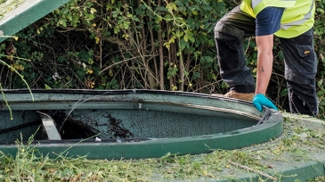 An engineer inspecting a sewage treatment plant