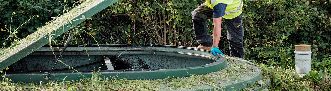 An engineer inspecting a sewage treatment plant
