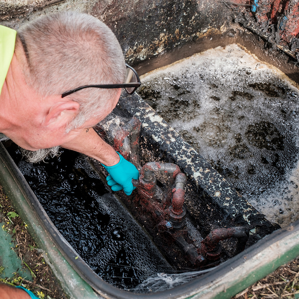 An engineer inspecting a sewage treatment plant