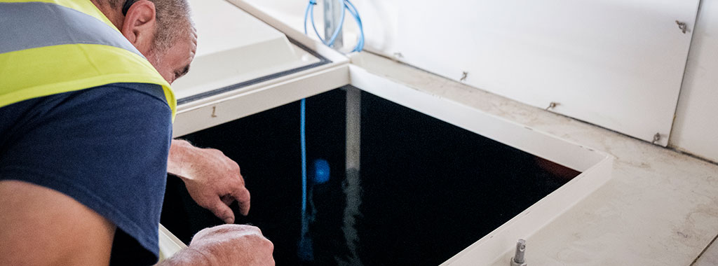 engineer checking a water hygiene system