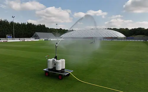 An image of our long reach irrigator on a football pitch