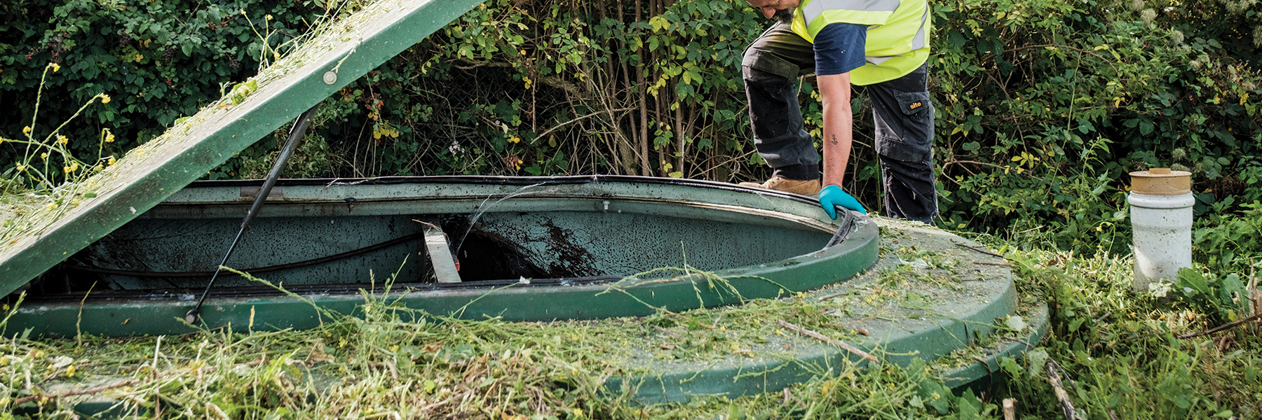 An engineer inspecting a sewage treatment plant