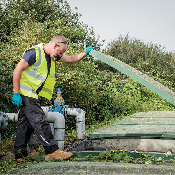 An engineer inspecting a sewage treatment plant