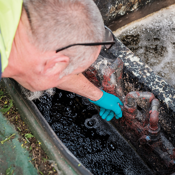 An engineer inspecting a sewage treatment plant