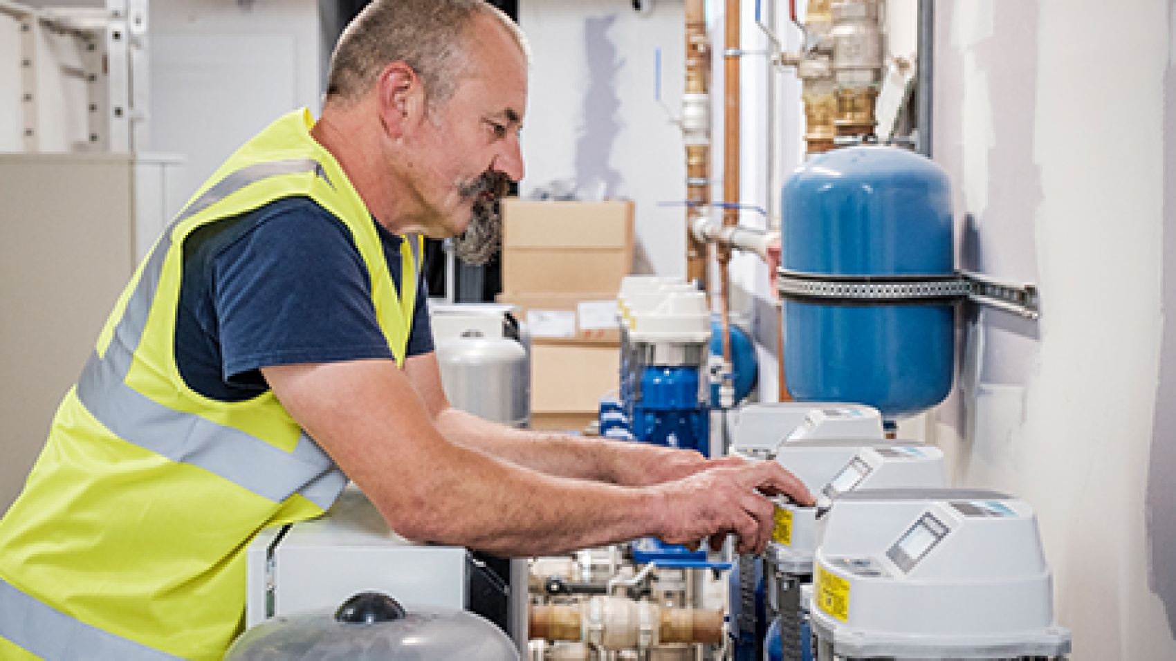 An image of an engineer programming a booster set